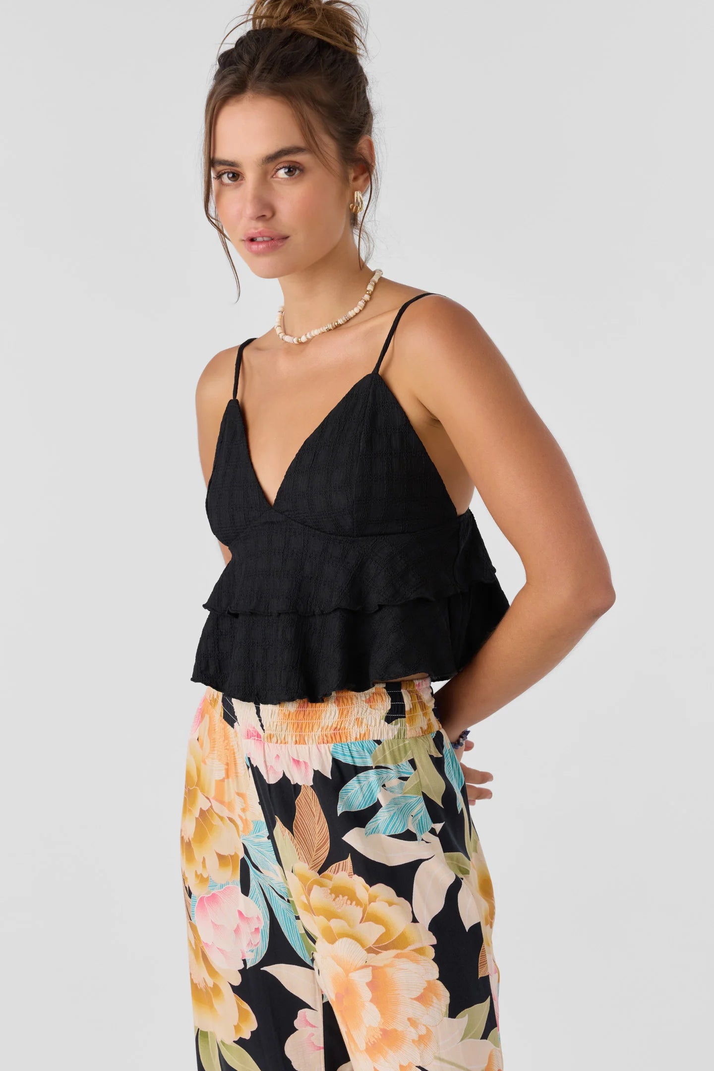 Offering endless ways to style, this flowy tank from O'Neill is available at Harbour Thread Burlington and features a tiered hem design and crop length fit. 