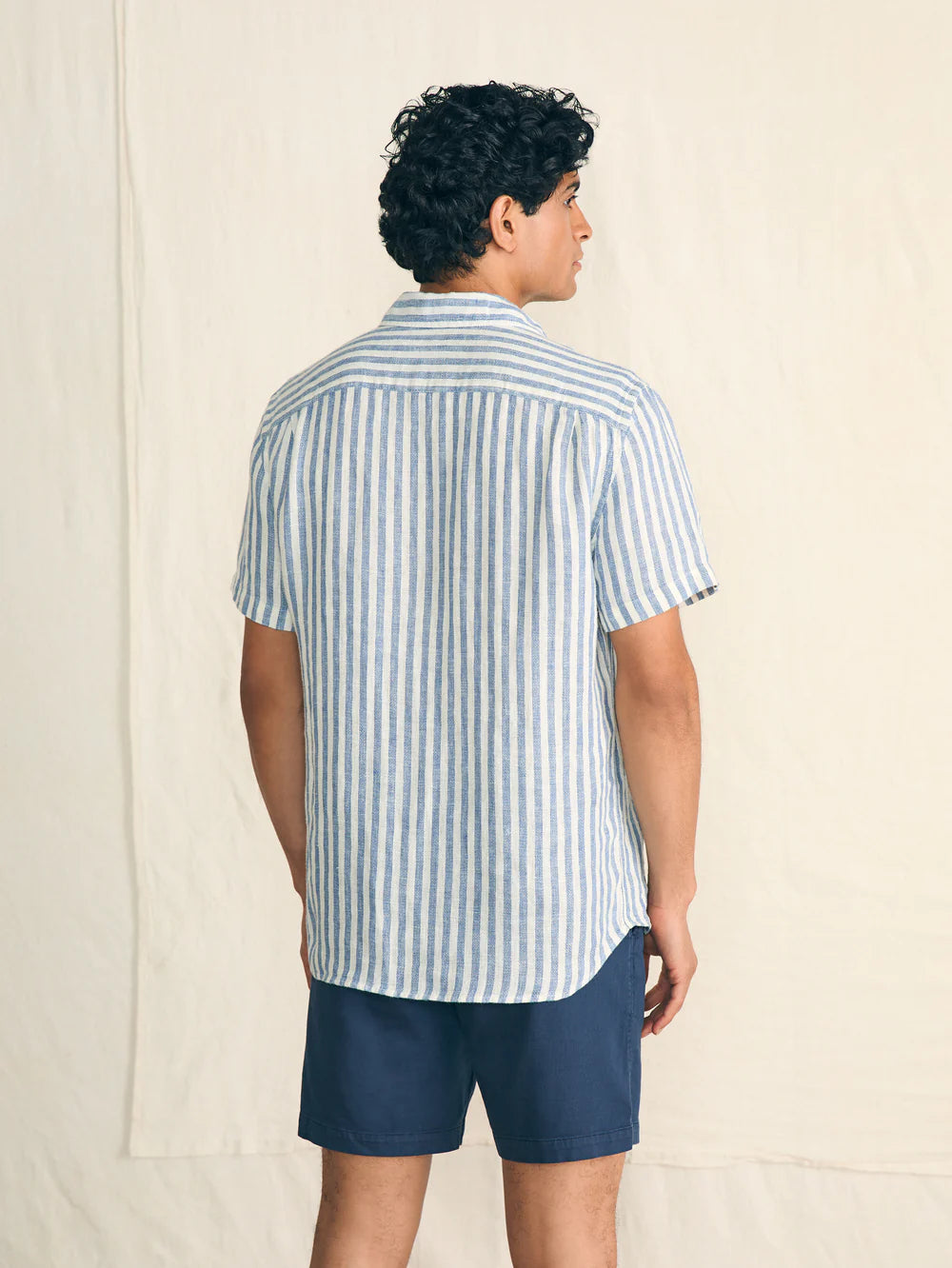 Back view of the Horizon Ivory Stripe Short Sleeve Palma Linen Shirt by Faherty