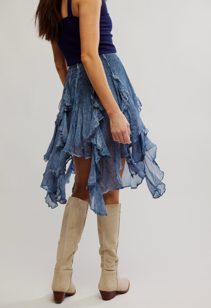 
                      
                        The Free People Susanna Knee-Length Midi Skirt offers a washed dye fabrication and pieced ruffle detail.
                      
                    