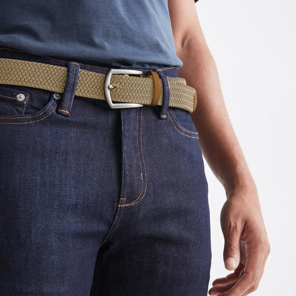 front view of man wearing the sand color Performance Stretch Belt by DU/ER