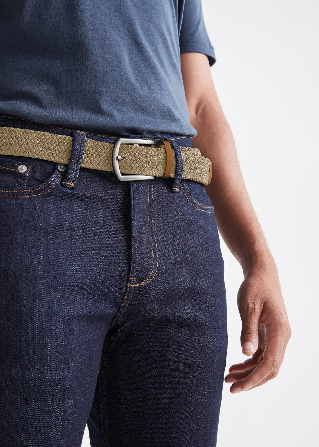 front view of man wearing the sand color Performance Stretch Belt by DU/ER