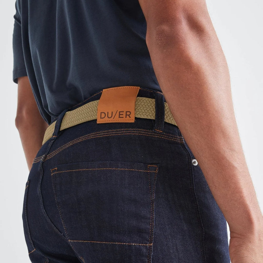 
                      
                        Back view of man wearing the sand color Performance Stretch Belt by DU/ER
                      
                    