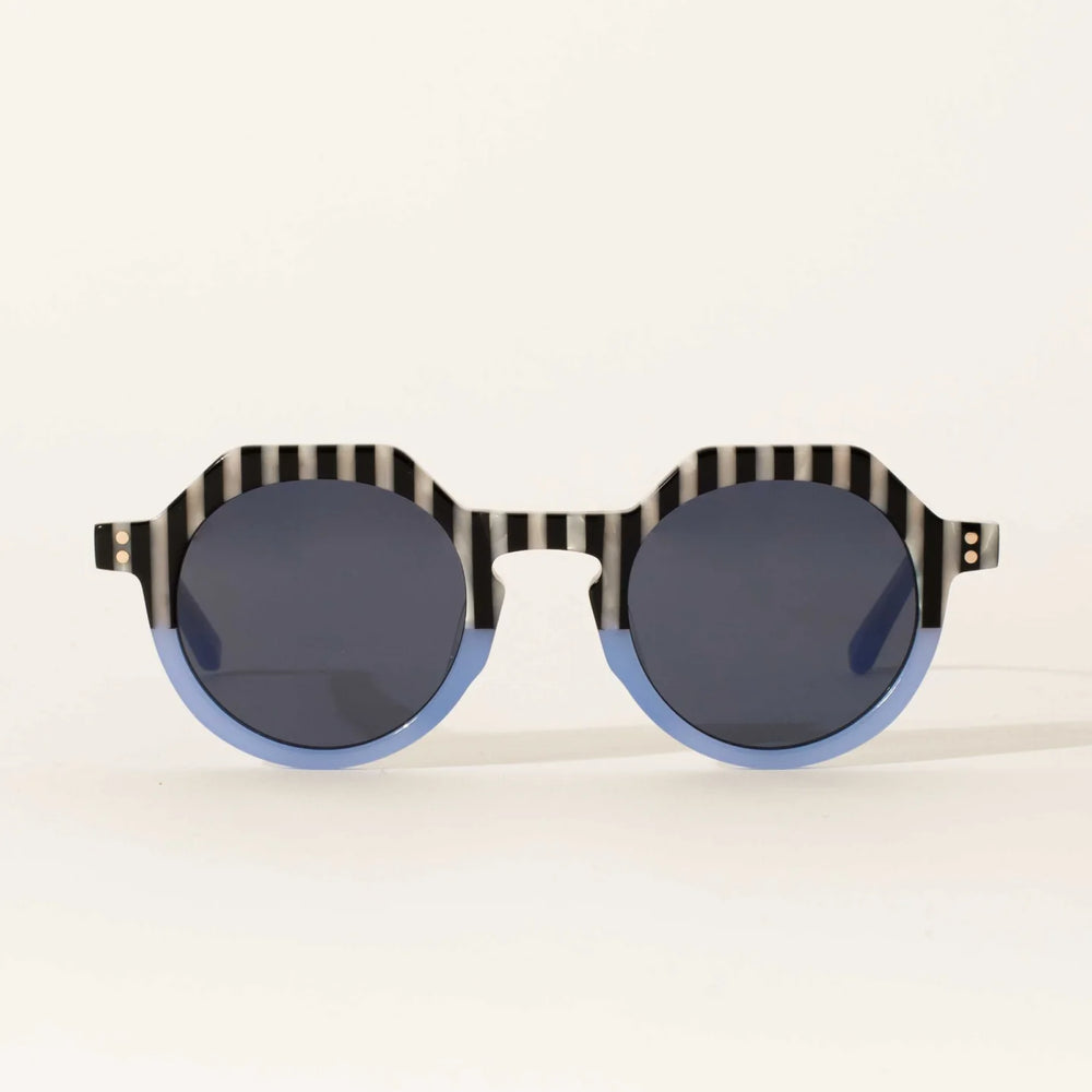 
                      
                        Women's light blue rounded sunglasses with black and white stripe details
                      
                    