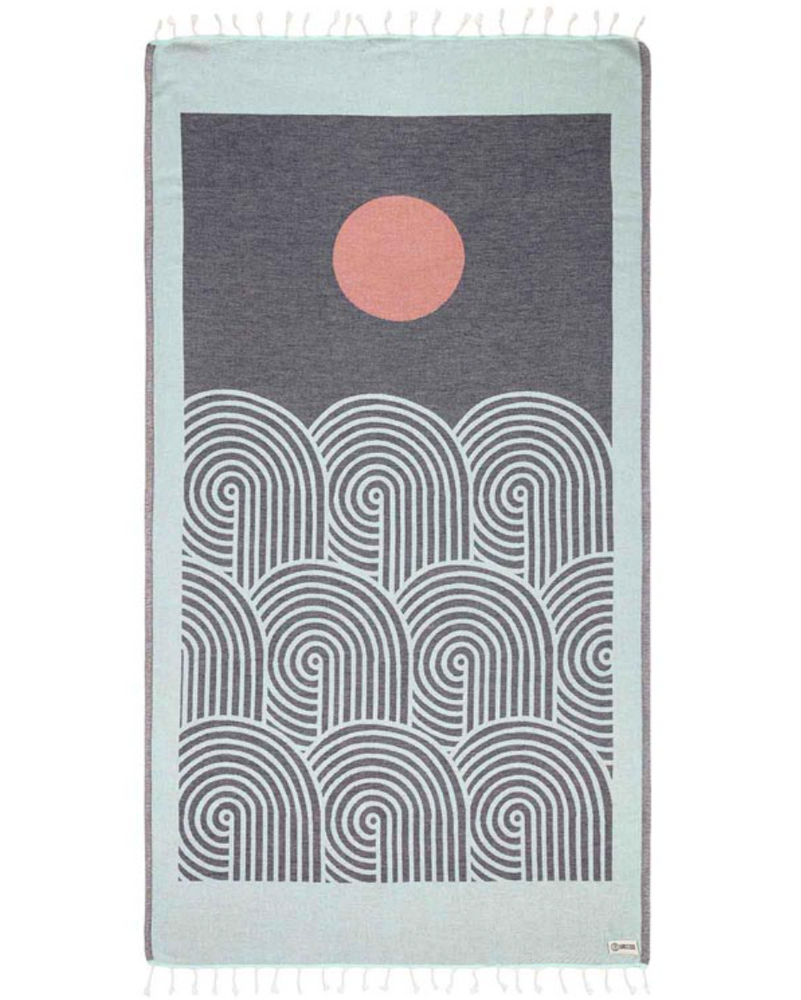 
                      
                        unfolded view of a sand cloud beach towel with an artful sun and sea inspired design and tassels at the ends
                      
                    