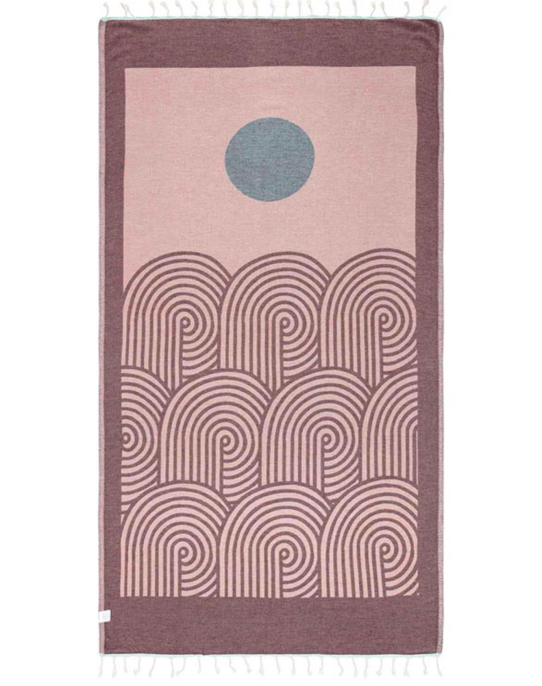 
                      
                        reverse color unfolded view of a sand cloud beach towel with an artful sun and sea inspired design and tassels at the ends
                      
                    