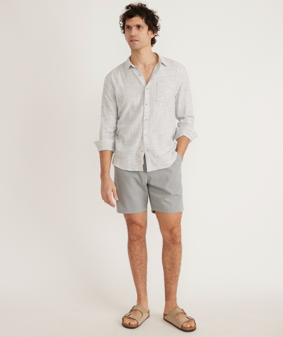 front view of men's button up shirt paired with shorts and sandals