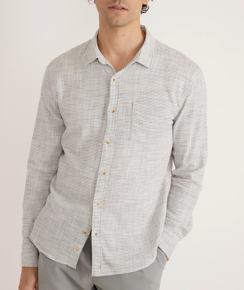 
                      
                        Front view of men's long sleeve classic stretch selvage button up shirt in color natural/black stripe by Marine Layer
                      
                    