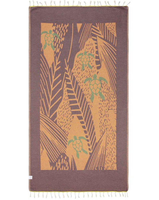 Unfolded reverse color view of the Reef Break beach towel featuring a design with turtles and sea plants and tassels at each end