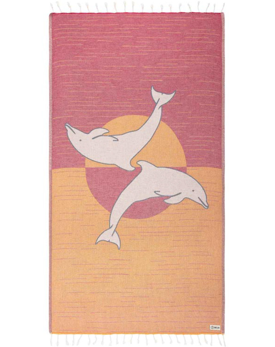 Unfolded view of the Sunset Dolphins beach towel by Sand Cloud