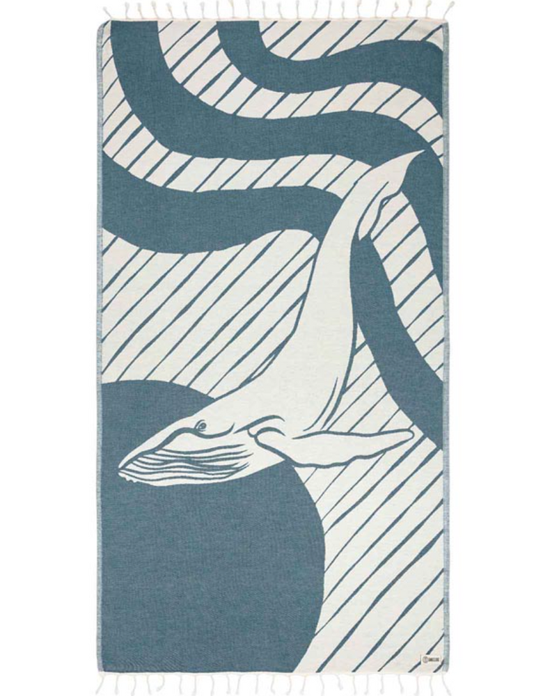 
                      
                        Unfolded view of a beach towel with a whale design and tassels at the ends
                      
                    