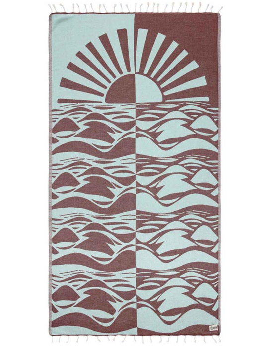 Unfolded view of Ripple Block organic turkish cotton beach towel with tassels at the ends and a mirrored sun and sea design