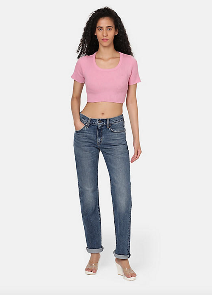 
                      
                        Front view of a woman wearing the medium wash straight leg women's jeans by Levi's
                      
                    