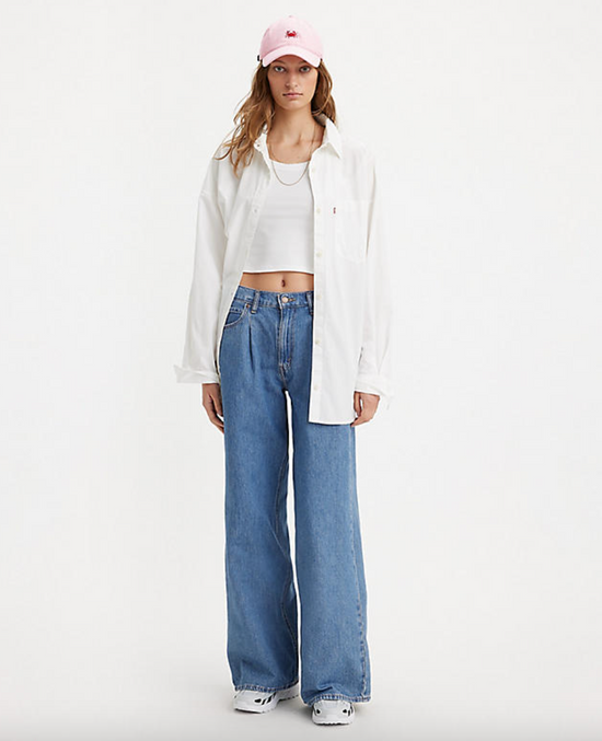 Front  view of a woman wearing the medium wash Baggy Dad Wide Leg Jeans by Levi's
