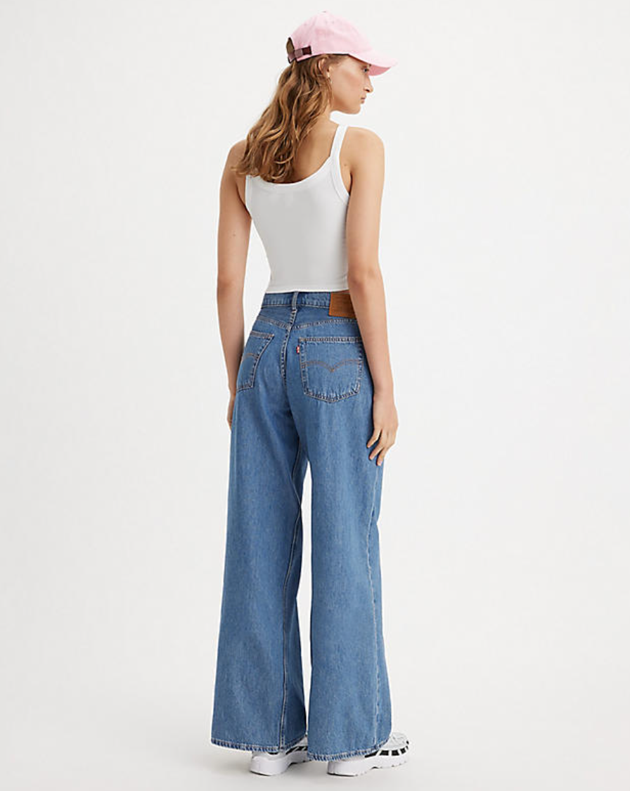 Back view of a woman wearing the medium wash Baggy Dad Wide Leg Jeans by Levi's