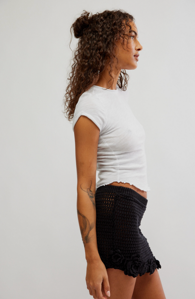 
                      
                        Side view of the Black Flora Crochet Mini Skirt by Free People
                      
                    