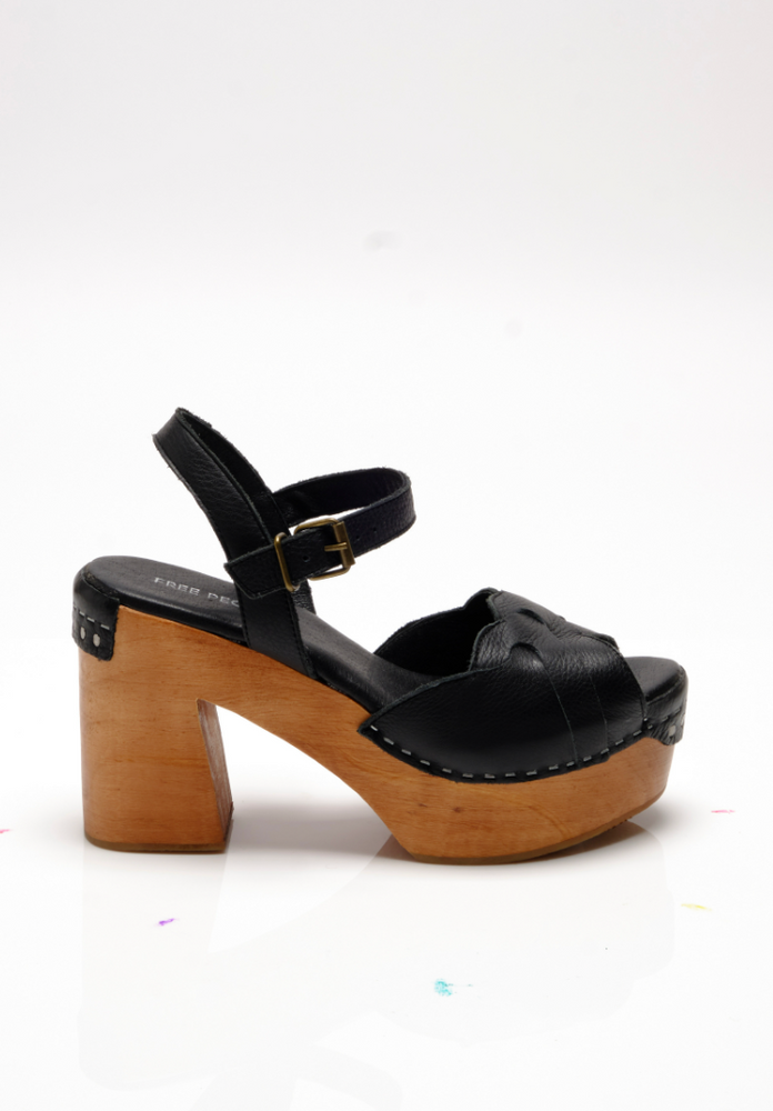 
                      
                        Side view of Free People's Black Orion Clogs
                      
                    