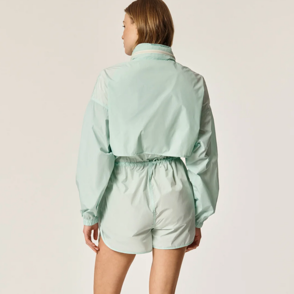 Back view of Oncept's Brooke Utility Romper in the color Aqua Chill