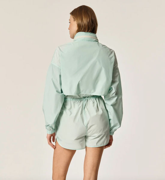 Back view of Oncept's Brooke Utility Romper in the color Aqua Chill