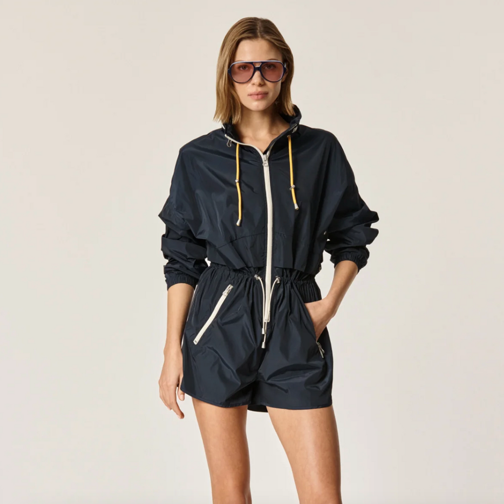 
                      
                        Oncept's Brooke Utility Romper in the color Indigo
                      
                    