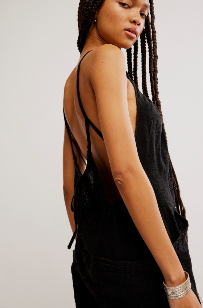 
                      
                        Side detail on the Black Dream Free Harem One-Piece by Free People
                      
                    