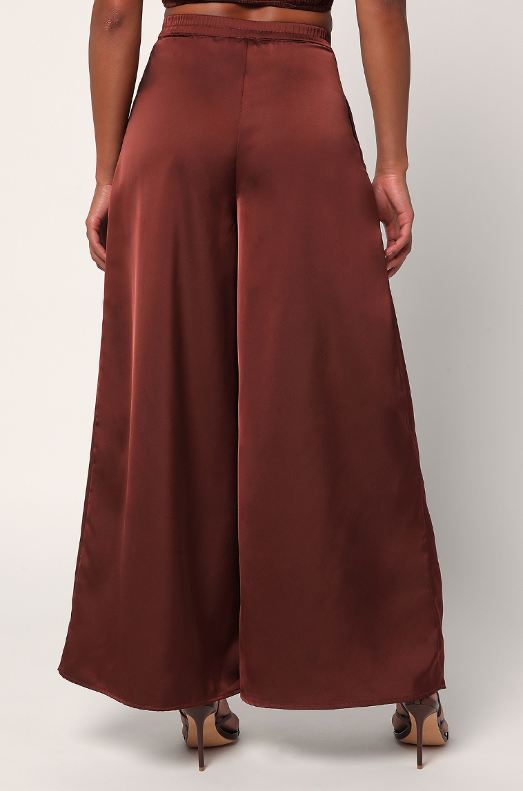 Back view of women's brown satin wide leg pants by Lulus