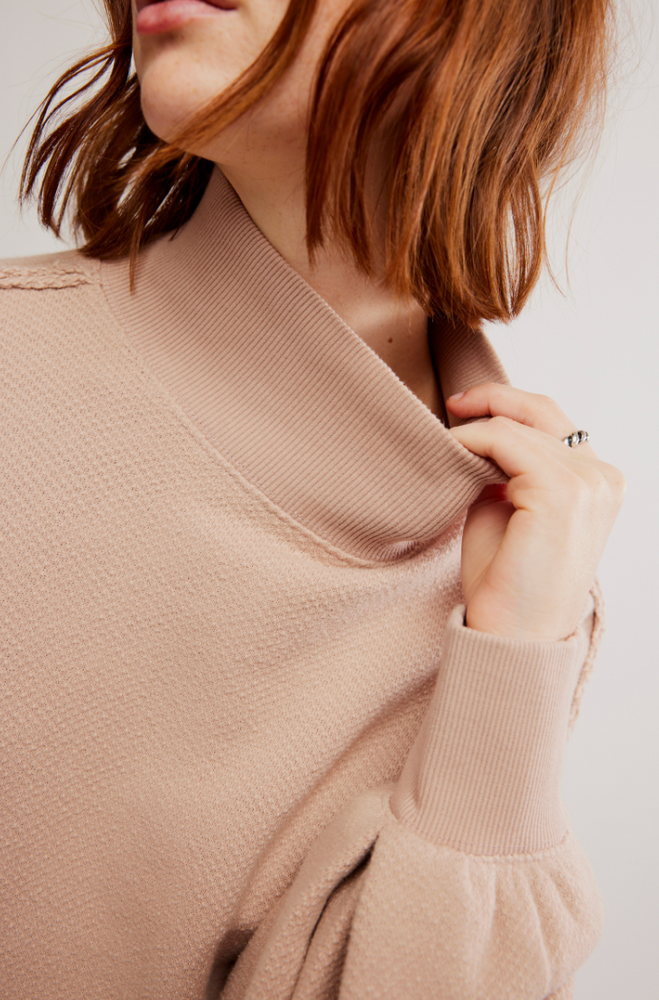 The Wonderful Pullover features a mock neckline