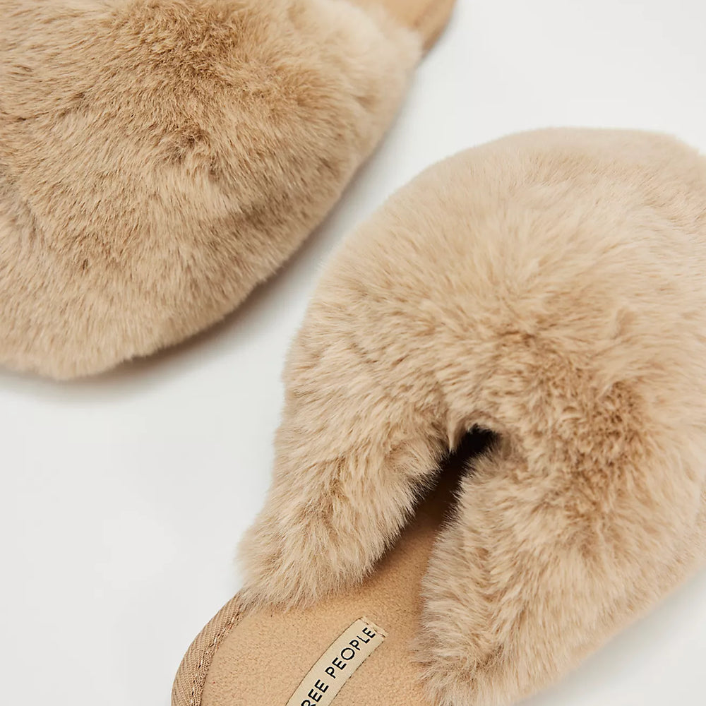 Start and end your days in comfort with these fluffy, faux fur slippers from Free People, now at Harbour Thread boutique