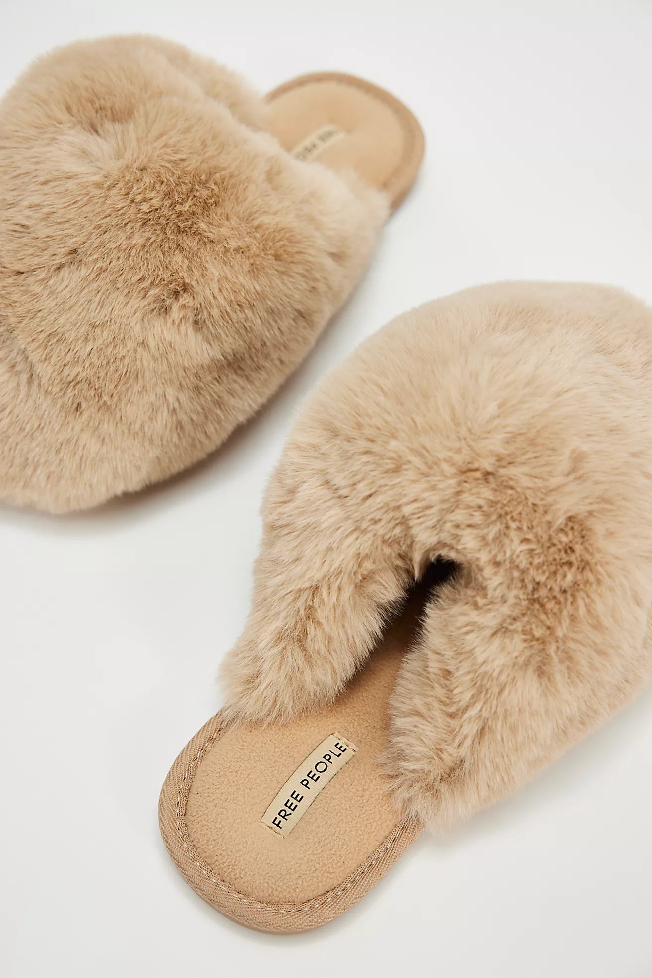 Start and end your days in comfort with these fluffy, faux fur slippers from Free People, now at Harbour Thread boutique