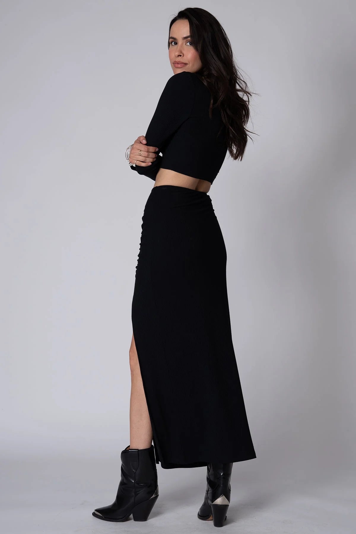 Back view of Stillwater's Get Together Maxi Skirt in the color Black