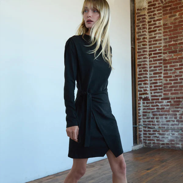 A woman wearing the Taylor Wrap Mini Dress by Nation LTD