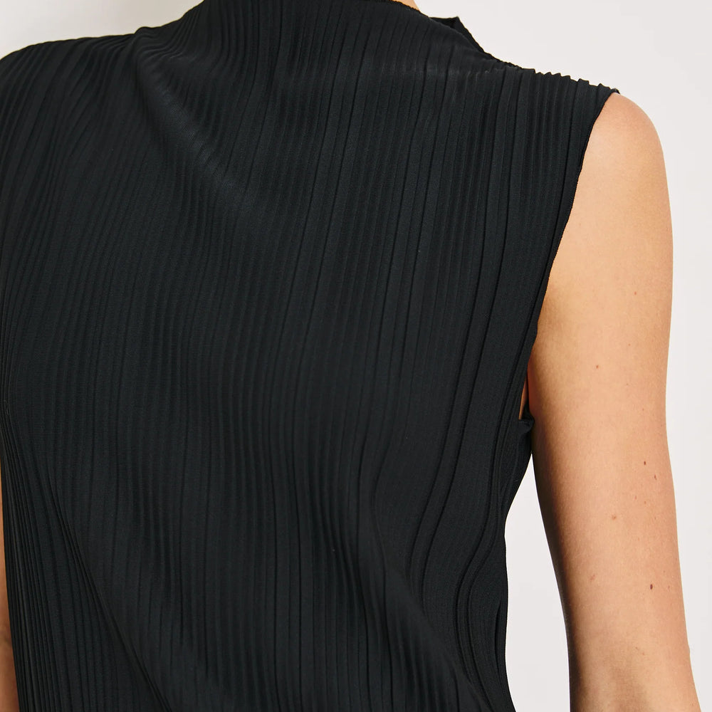 The Trea is a women's sleeveless mock-neck top