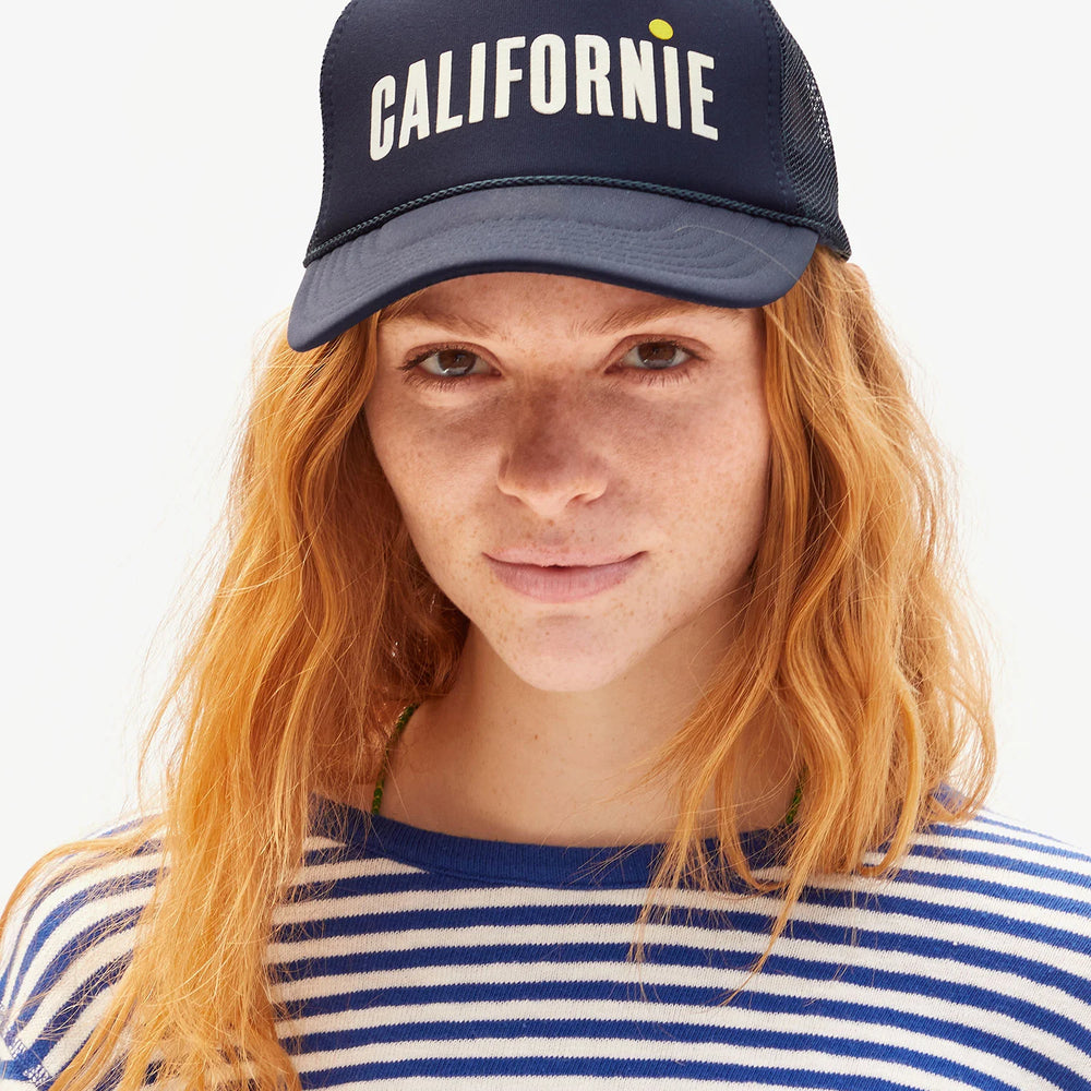 
                      
                        The Californie Clare V. Trucker Hat in Navy and Cream
                      
                    