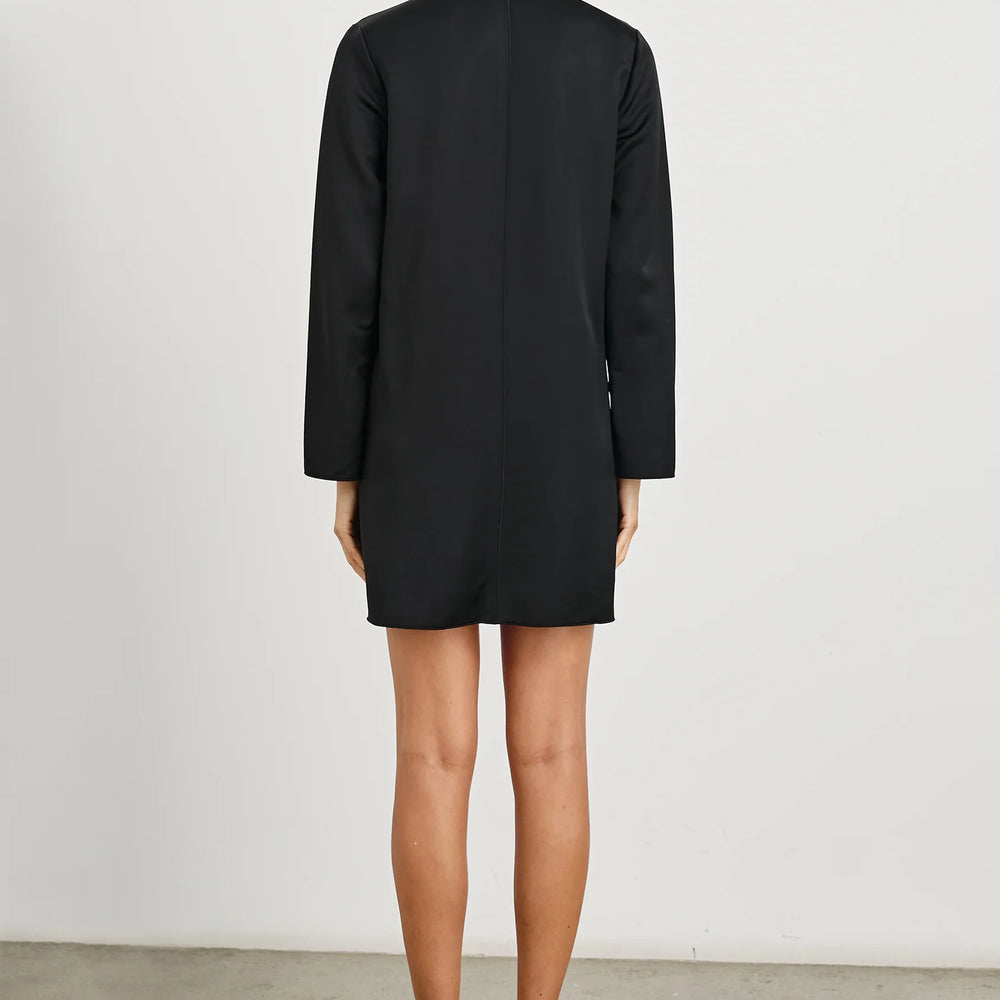 
                      
                        This long sleeve black shift dress is finished with marrow-edged raw seams
                      
                    