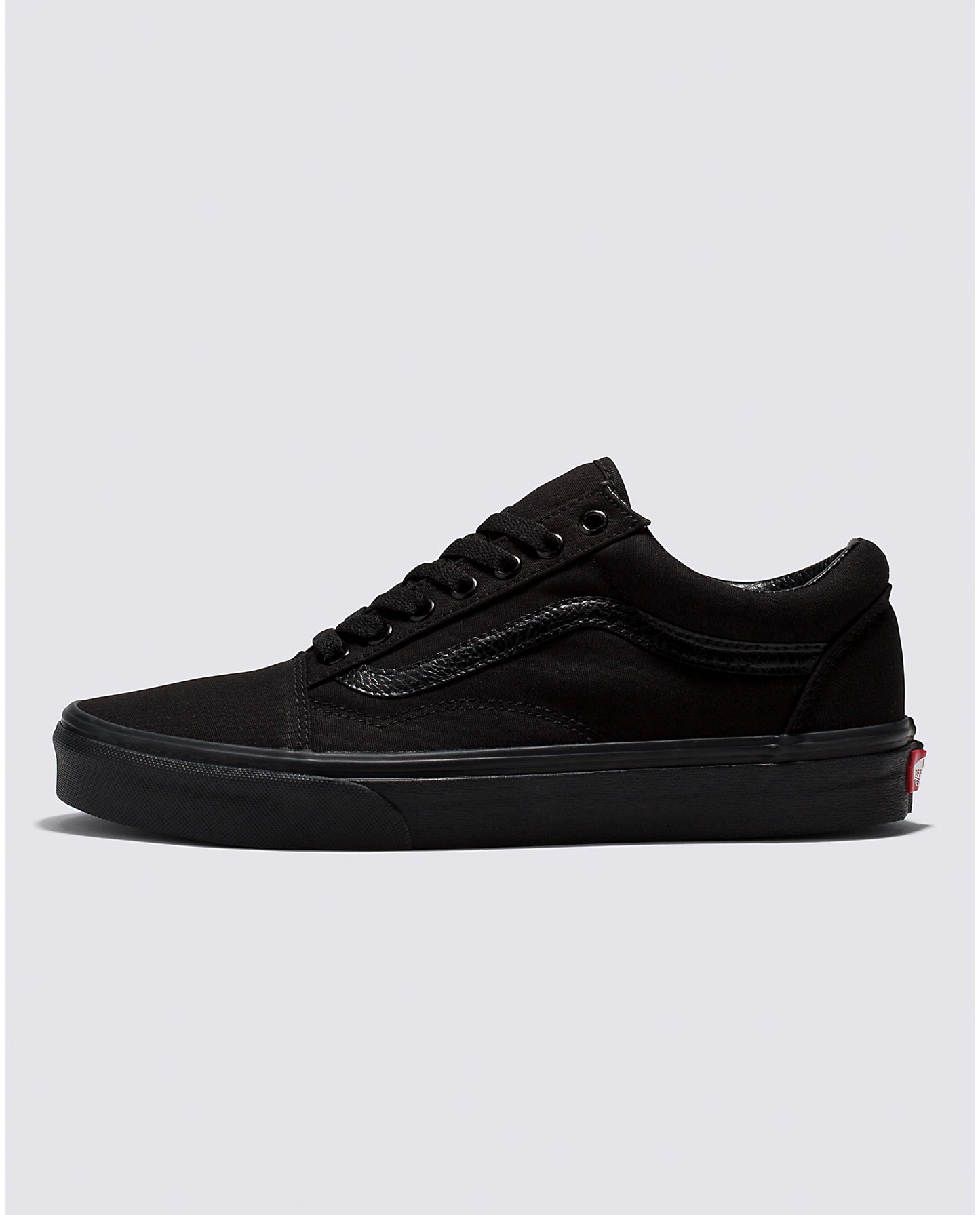 Side profile view of the Vans Men's all black Canvas Old Skool Sneaker