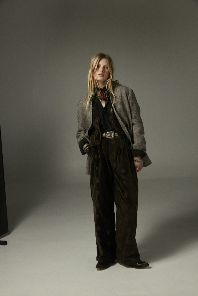 
                      
                        Person wearing a gray coat paired with the Maison Hotel Paco Pant
                      
                    