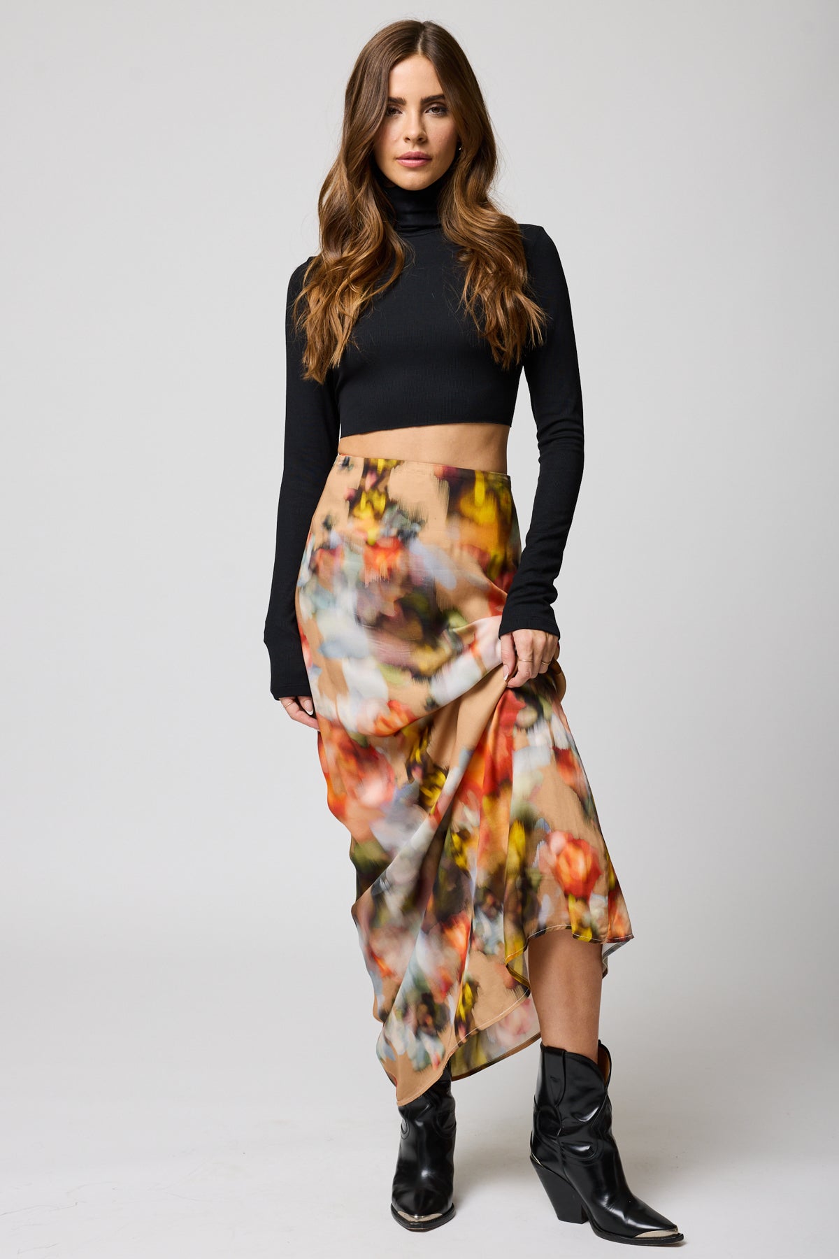 Front view of a woman wearing the Watercolor Floral Good Grace maxi Skirt by Stillwater