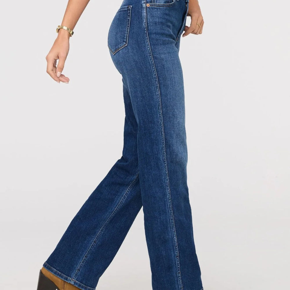 
                      
                        Person wearing blue jeans and brown shoes on a white background
                      
                    