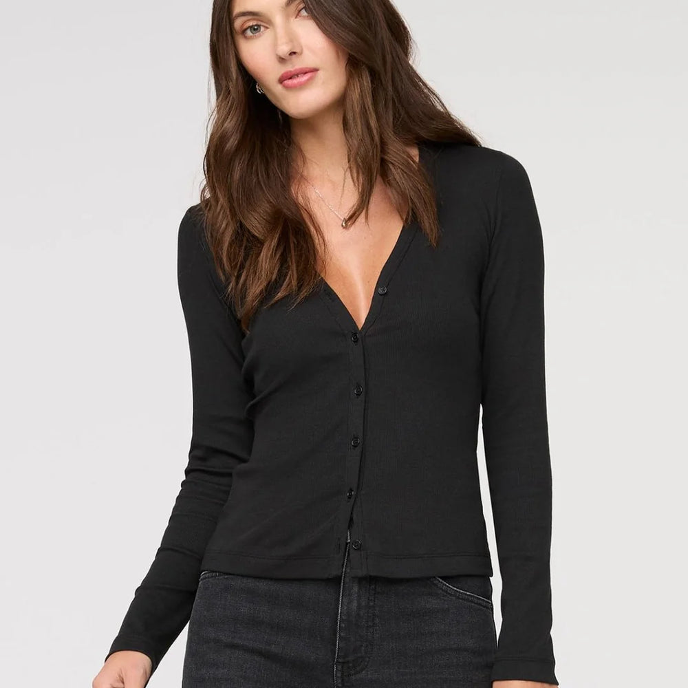 
                      
                        This slim-fitting long sleeve top offers a flattering deep v-neckline and a standard hip-length hem. Find yours at Harbour Thread boutique in Burlington, VT.
                      
                    