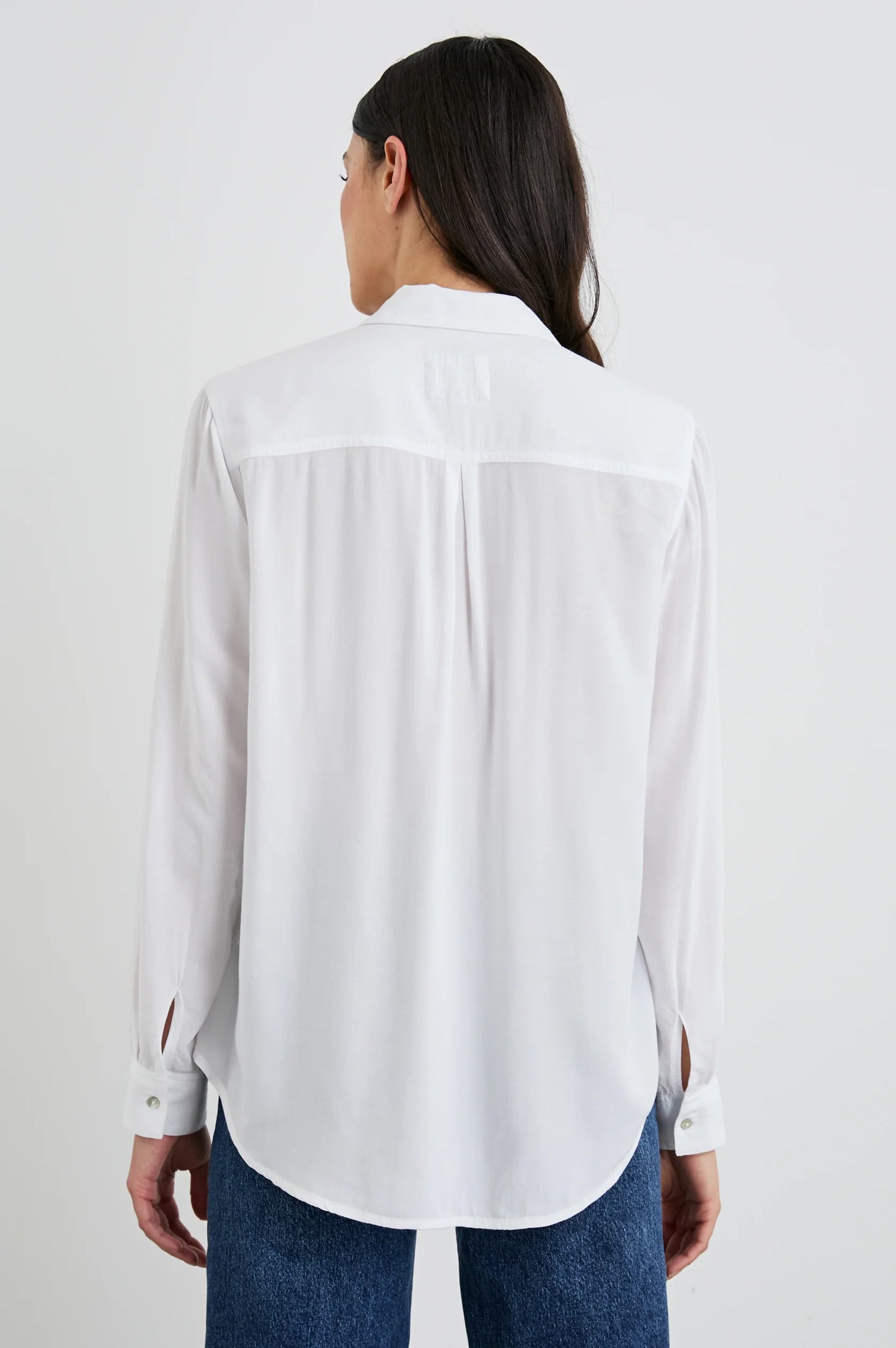 Back view of a woman wearing the White Wren Button Down Shirt by Rails