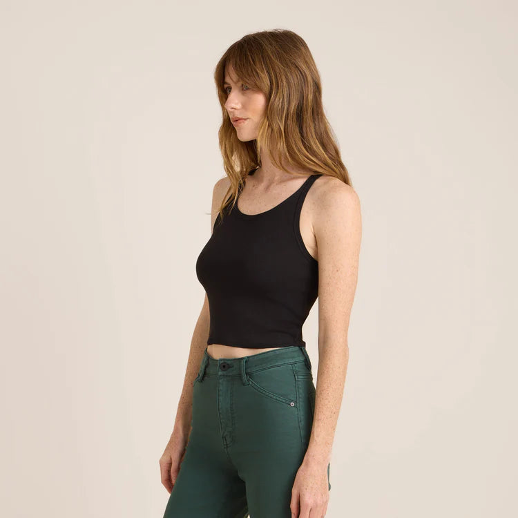 
                      
                        Side view of a woman wearing the Black Wind Worn Tank by Roark
                      
                    