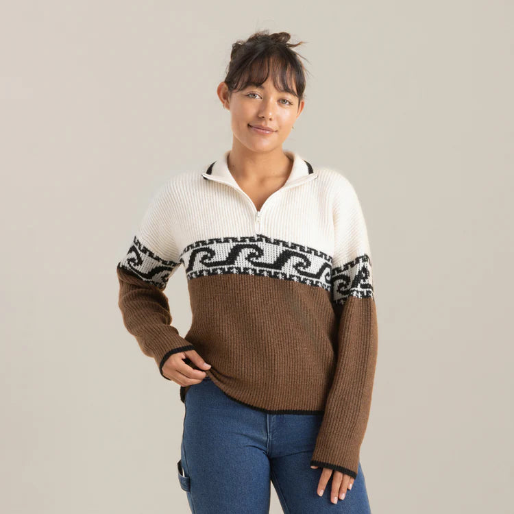 
                      
                        Front view of a woman wearing the Roark Fjord Sweater in the color Saddle
                      
                    