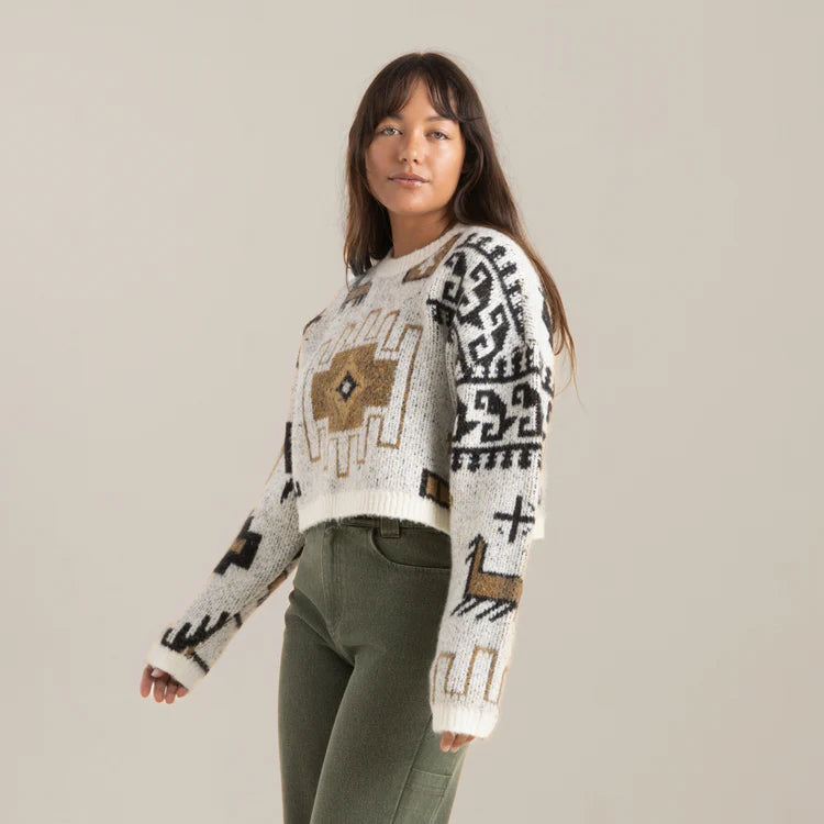 A woman wearing the Kos Sweater by the brand Roark