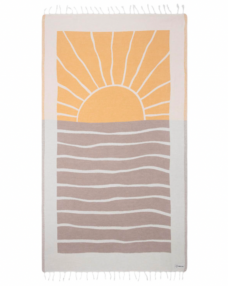 Enjoy your time in the sand with the eco-conscious Sand Cloud Earth Towel, available at Harbour Thread boutique. 