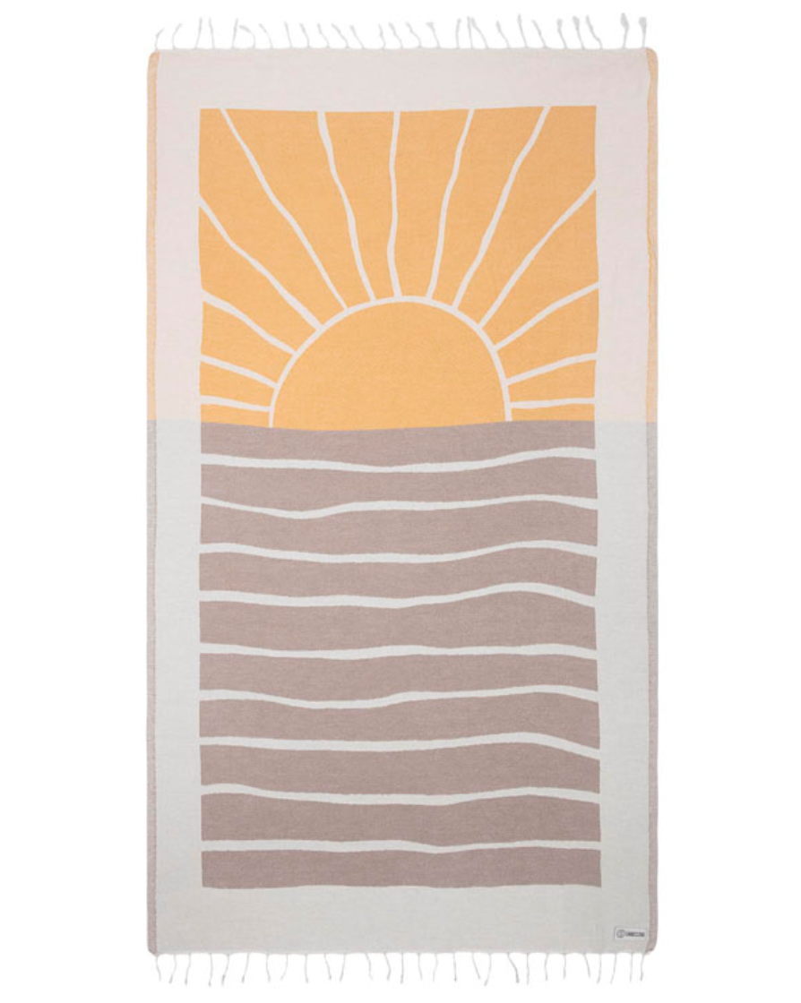 Enjoy your time in the sand with the eco-conscious Sand Cloud Earth Towel, available at Harbour Thread boutique. 