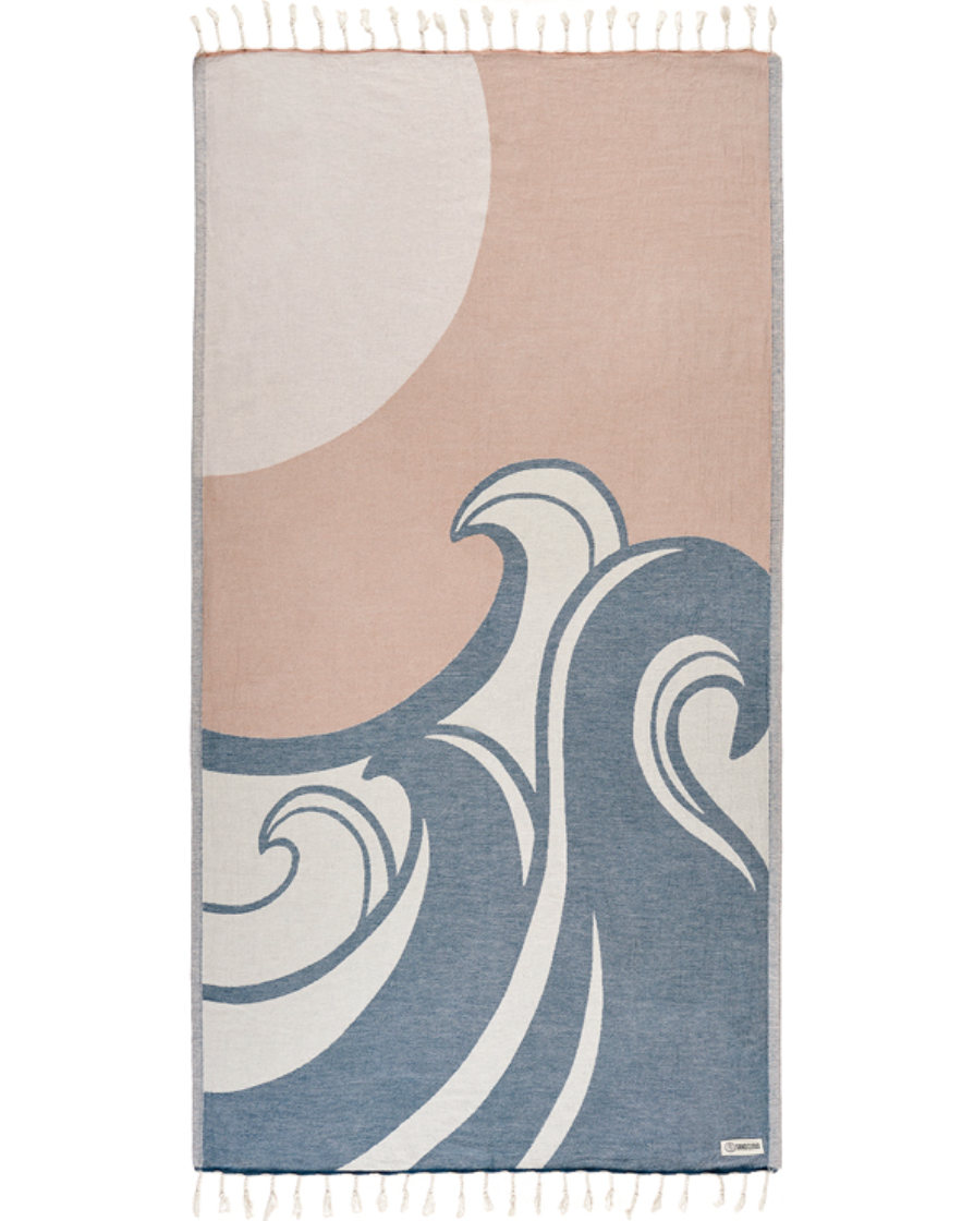 Enjoy your time in the sand with the eco-conscious Sand Cloud Ezili Towel, available at Harbour Thread boutique. 