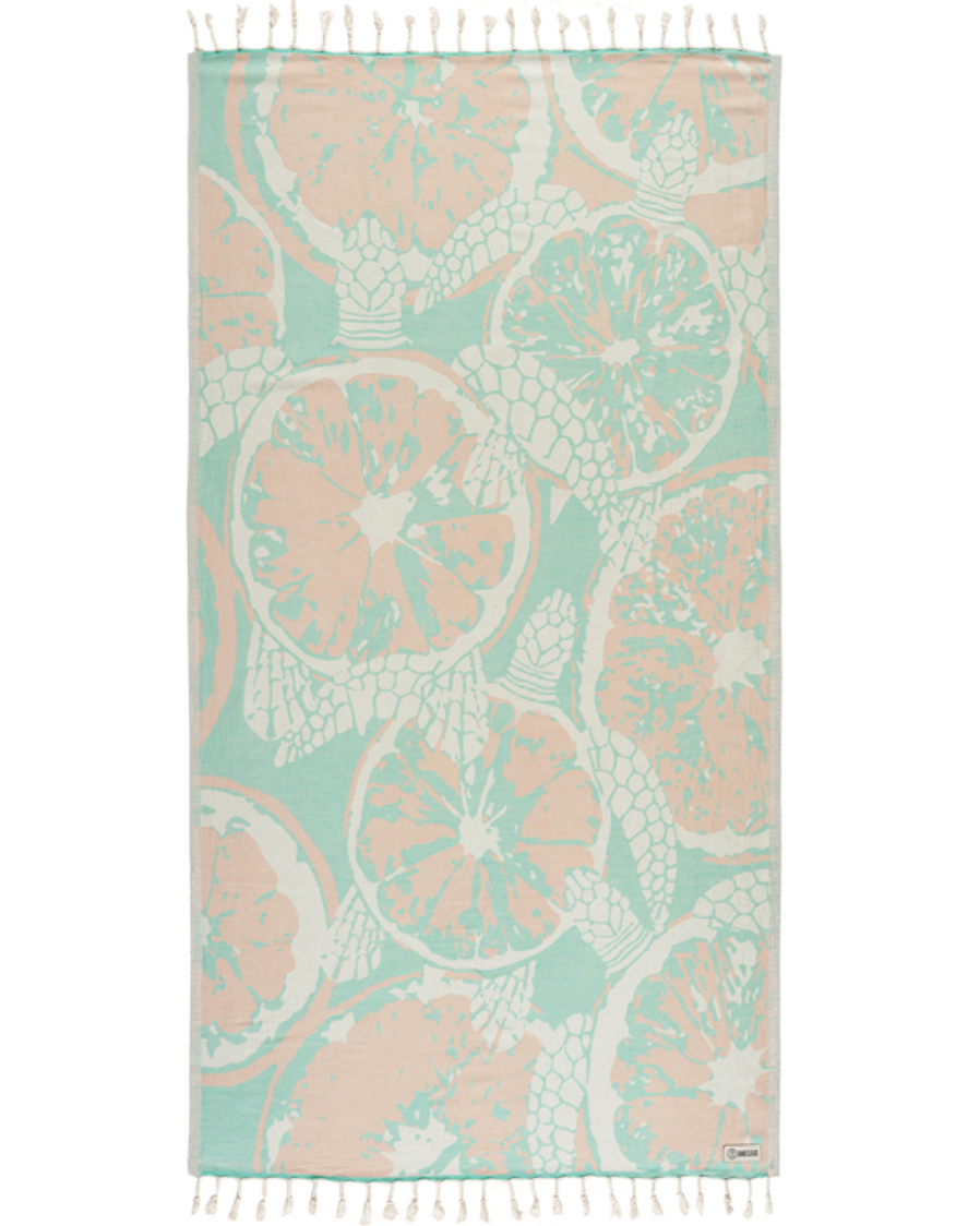 Enjoy your time in the sand with the eco-conscious Sand Cloud Oroblanco Towel, available at Harbour Thread boutique.