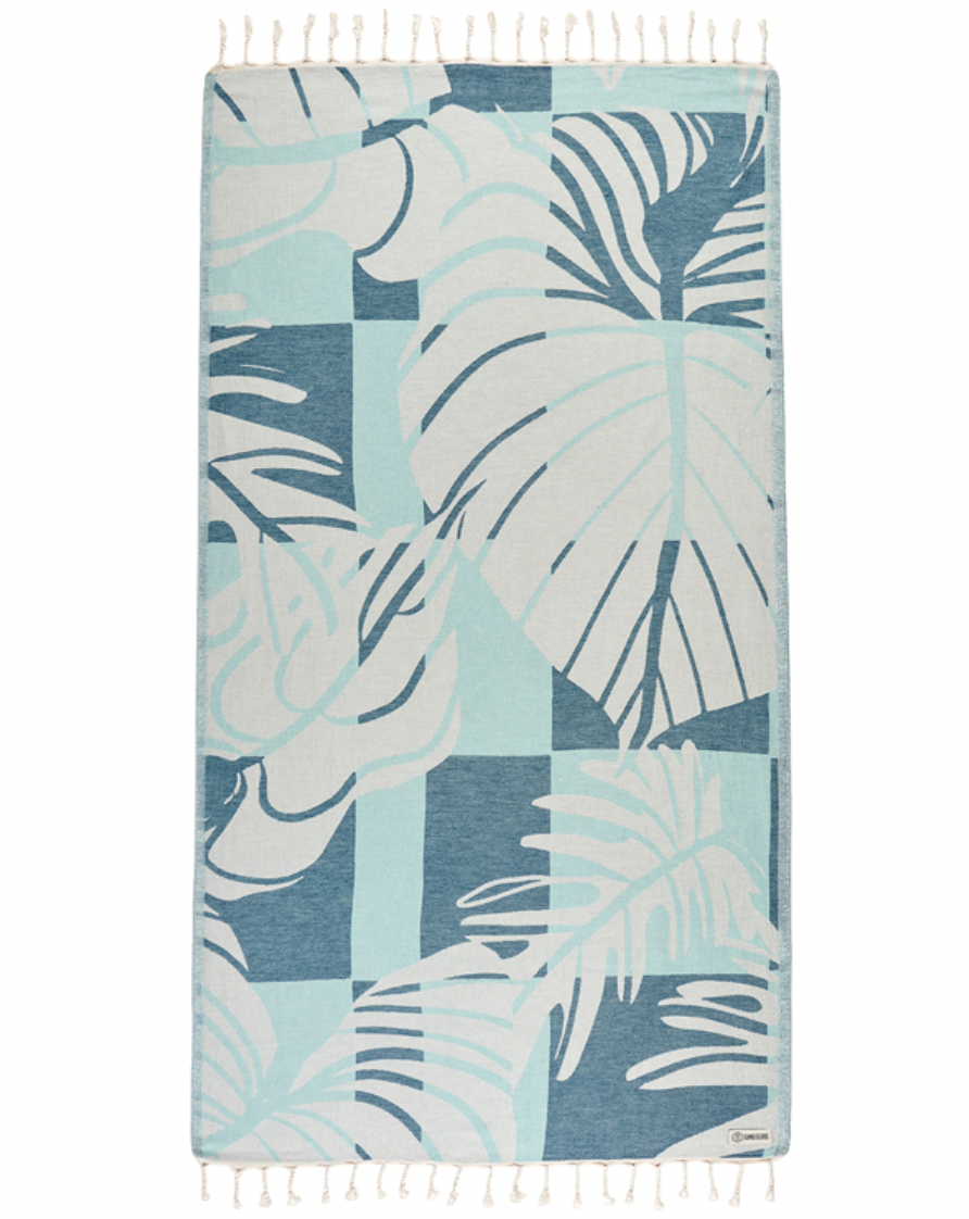 Enjoy your time in the sand with the eco-conscious Sand Cloud Cutleaf Towel, available at Harbour Thread boutique. 