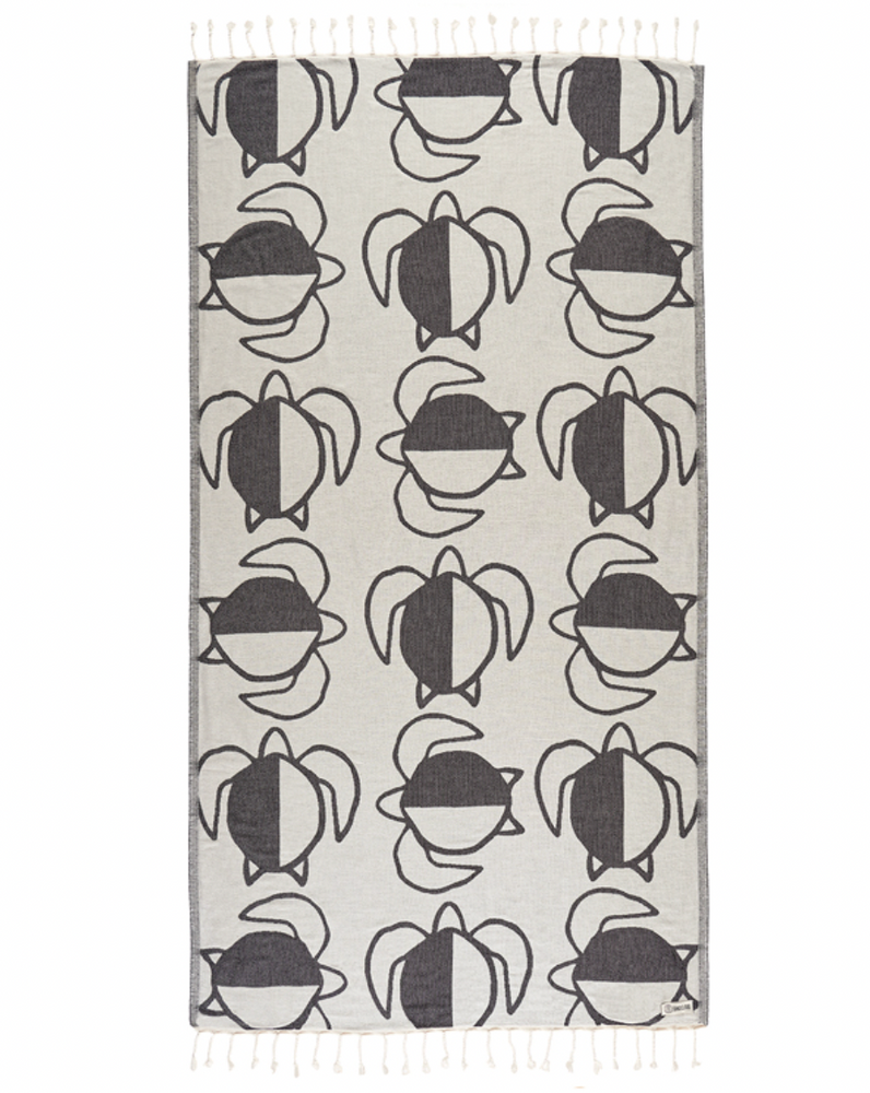 Enjoy your time in the sand with the eco-conscious Sand Cloud Turtle Checkers Towel, available at Harbour Thread boutique. 