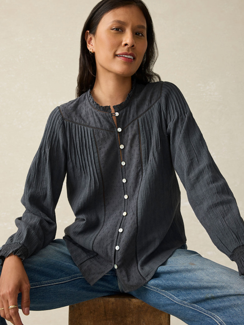 A woman wearing the Washed Black Lily Top by Faherty