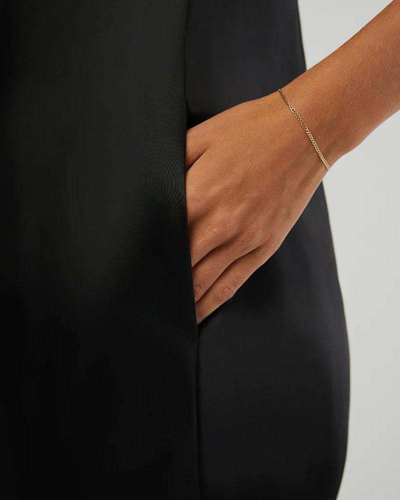 
                      
                        Strapless jumpsuit with convenient side pockets
                      
                    